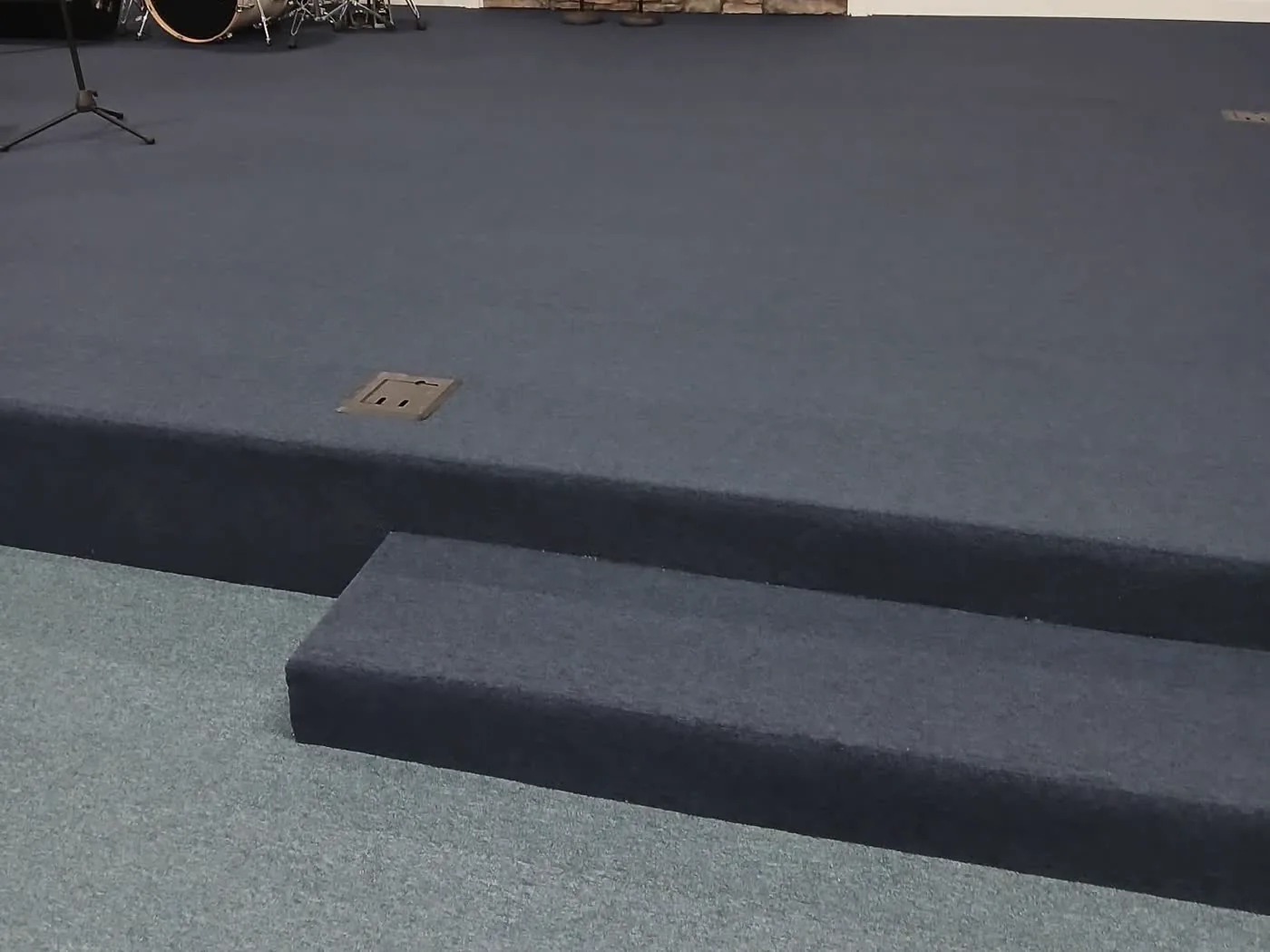Commercial carpet and wrapped stage steps installed in a church