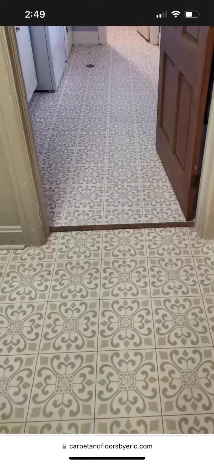 Patterned sheet vinyl floor installed in a hallway